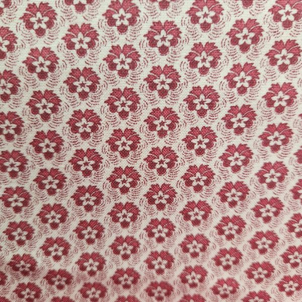 Tela fondo beige flores rojas